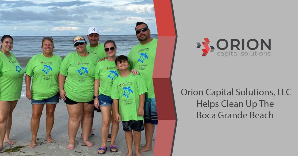 Orion team members at beach cleanup